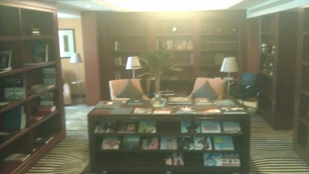 Relaxing library/lounge with numerous books and magazines available in various languages.